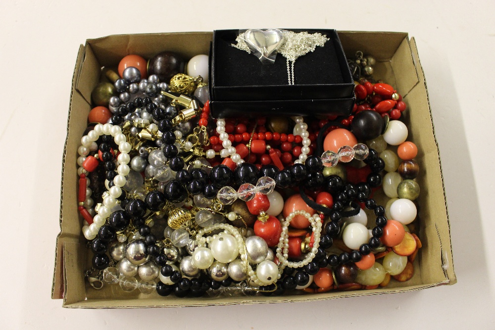 A tray of costume necklaces and bracelets