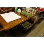 An oak refectory style dining table with a set of