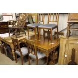 An oak draw leaf dining table with a set of 6 rail