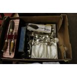 A box of various cutlery and a carving set