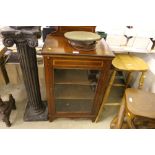 An Edwardian mahogany inlaid music cabinet