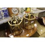 A pair of brass and glass lanterns