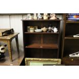 A mahogany open fronted bookcase