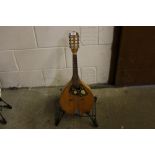 An inlaid mandolin on stand