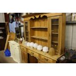 A stripped pine dresser, fitted three drawers