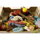 A box containing four wooden Pelham puppets and on