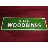 A "Will's Woodbines" enamel sign, 71cm x 23cm