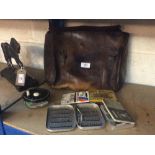 A leather fishing bag and various contents to incl