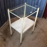 A retro two tier medical style trolley with plate