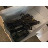 A box of miscellaneous tools including spanners, a