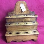 A 19th Century three tier oak spoon rack