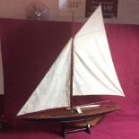 A vintage large model of a racing yacht, 90cm