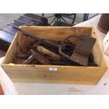 A tray of various agricultural hand tools