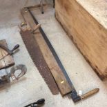 An old cross cut saw and another