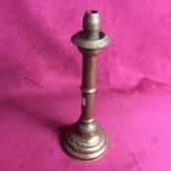 A vintage patent brass candlestick