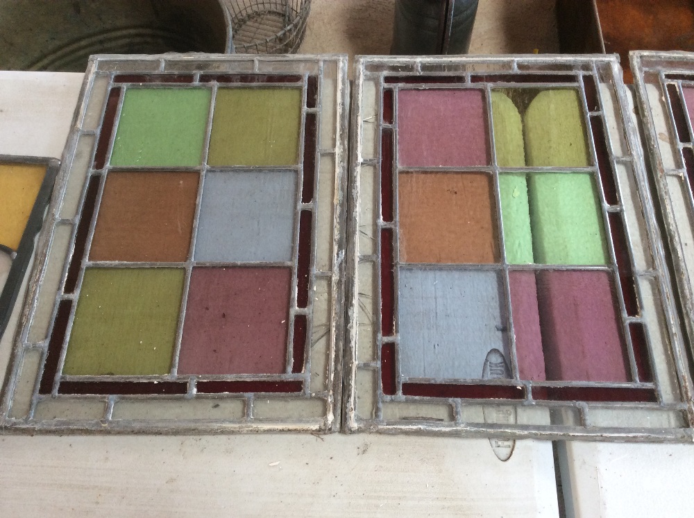 Four old coloured and leaded glass lights