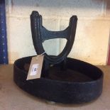 A cast iron boot scraper