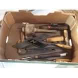 A box of vintage woodworking tools including chise