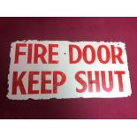 An enamel "Fire Door Keep Shut" sign, 48cm x 23.5cm