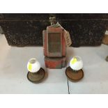 A pair of small oil lamps and an unusual shaped oil lamp