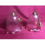 A pair of large globular tinted ceiling lights, (c