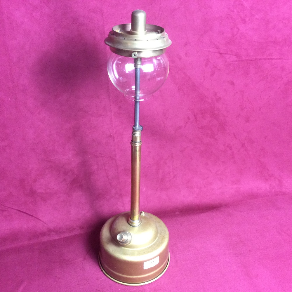 A tilley lamp with pork-pie font and long stem