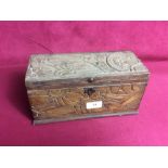 An Antique carved wooden box with foliage decorati