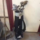 A bag of miscellaneous golf clubs