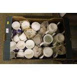 A box of various white glazed teaware