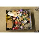 A box containing old Christmas decorations and var