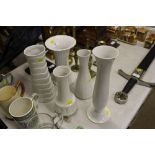 Five white glazed china vases