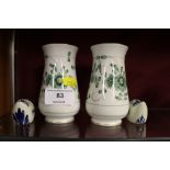 A pair of small Meissen decorated vases; and a pai