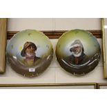 A pair of wall plates each depicting fisherman