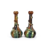 A large pair of Belgian pottery Art vases, decorated green, blue and brown running glazes with