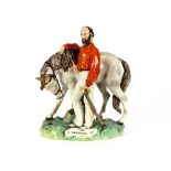 A large 19th Century Staffordshire figure, depicting Garibaldi beside his horse, 38.5cm high