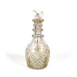 A good quality hob-nail cut decanter, having three sections and faceted stoppers, 28cm high