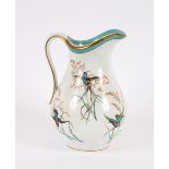 A large Victorian pottery toilet jug, decorated with hummingbirds