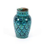 An Isnic blue glazed baluster vase, having stylised decoration, 18cm high