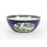 A 19th Century Chinese famille verte bowl, decorated river scenes, flowers and objects, 31cm dia.