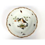 A pair of Meissen chargers, profusely decorated with birds, butterflies and other insects, within