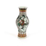 A 19th Century Chinese famille verte baluster vase, of hexagonal form, decorated with figures in