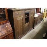 A stained pine cabinet fitted two drawers