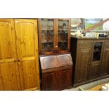 A reproduction mahogany bureau bookcase