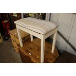 A painted and upholstered stool