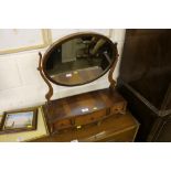 A reproduction yew wood dressing table mirror