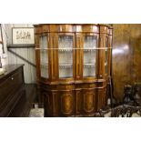 An Italian style inlaid and glazed bookcase