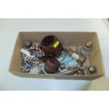 A box containing silver topped bottles, corkscrews