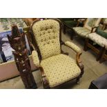 A Victorian walnut and upholstered armchair