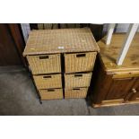 A wicker and metal six drawer chest