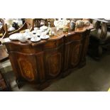 An Italian style serpentine front sideboard